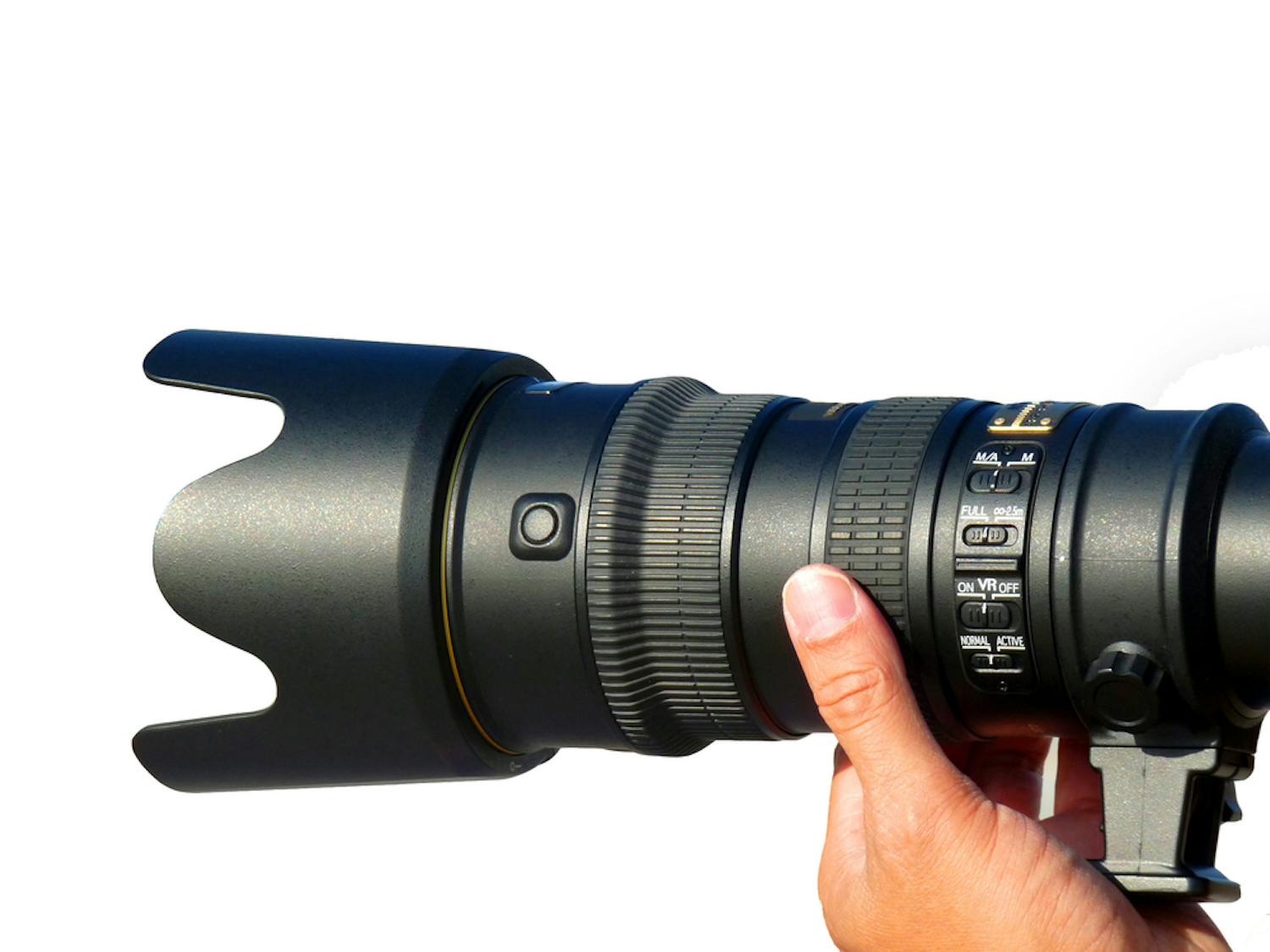 teleobjektiv med knapper giver bedre billeder teleobjektiv med mange knapper holdes opp i varmt lys